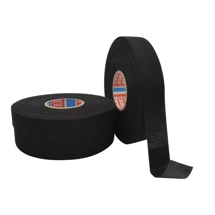 Tesa 51608 PET fleece tape, used for flexibility and noise protection.